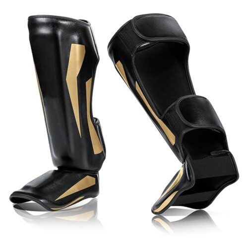 Custom-fit leather shin guards for boxing and martial arts.